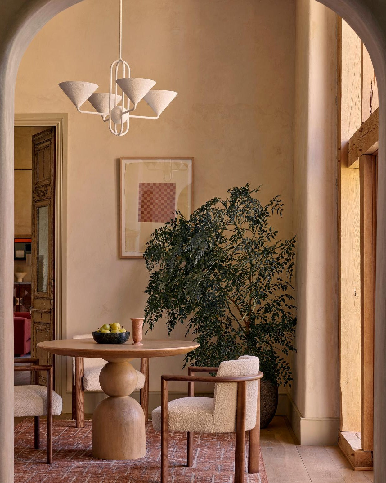 Dining room with statement chandelier above table by UTLamps